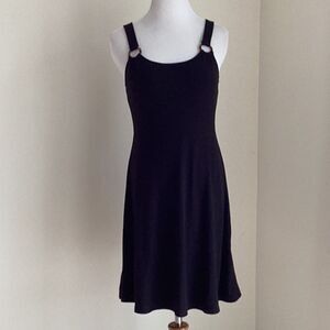 Black simple but cute dress with ring accents size Small above the knee